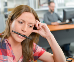 Patient in Mt. Dora biting a pen