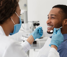 Dental implant patient in Mt. Dora smiling after dental cleaning