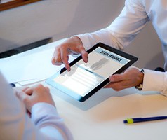 Patient reviewing dental insurance information on tablet