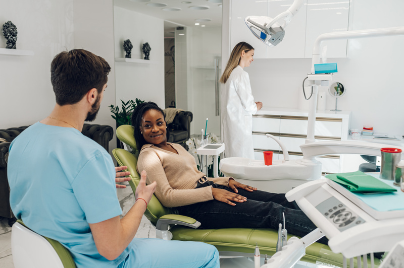 Patient smiling with dentist at dental checkup